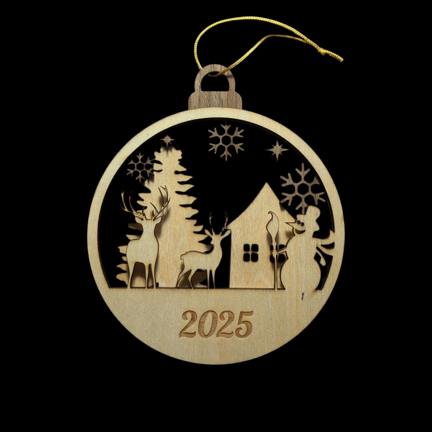 Wooden Christmas ornament with a house, trees, and deer silhouette, featuring the year 2025 on a black background.