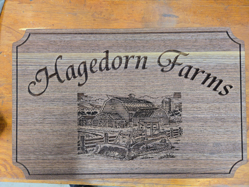 Custom carved with laser engraved farm scene cutting board