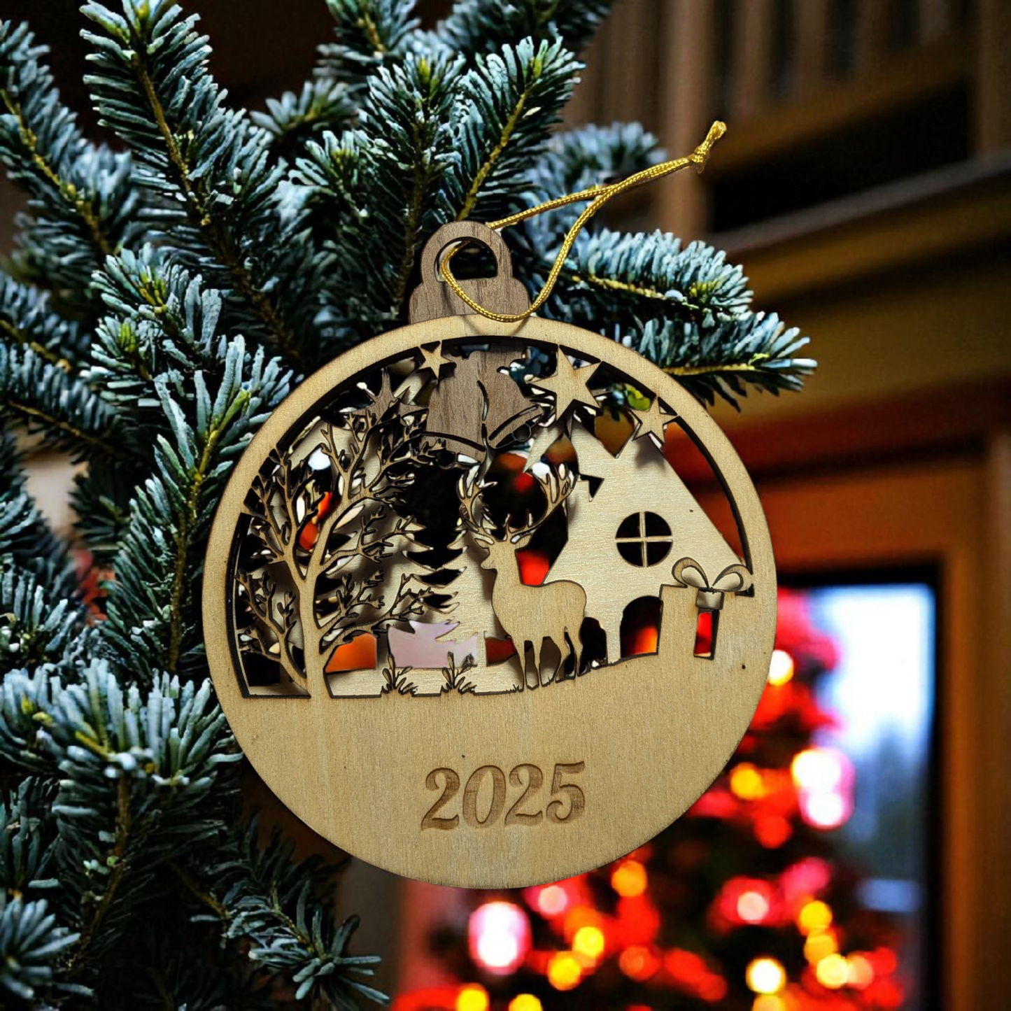 Wooden Christmas ornament with deer design and '2025' on a tree with blurred lights in the background