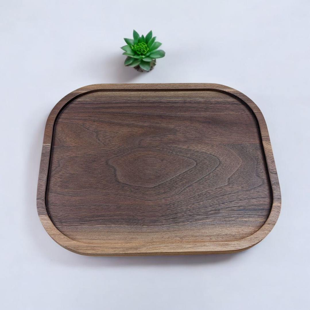 Wooden tray on a white background with a small green plant